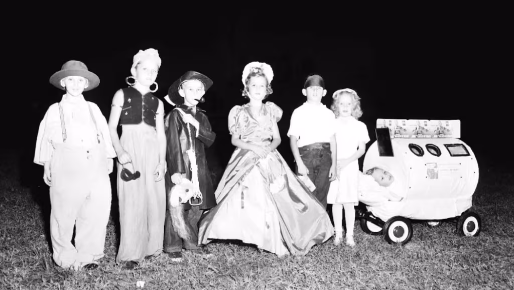 This public children's Halloween party in Stuart in 1951 includes one child in a replica of an iron lung.